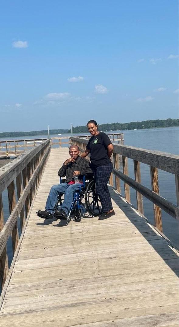 Caregiver with client on pier